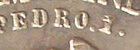 Detalhe de moeda de 2000 réis de 1922 pedro com ponto